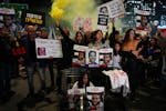 Relatives and supporters of Israeli hostages being held in the Gaza Strip by Hamas attend a rally calling for their release in Tel Aviv on Tuesday.