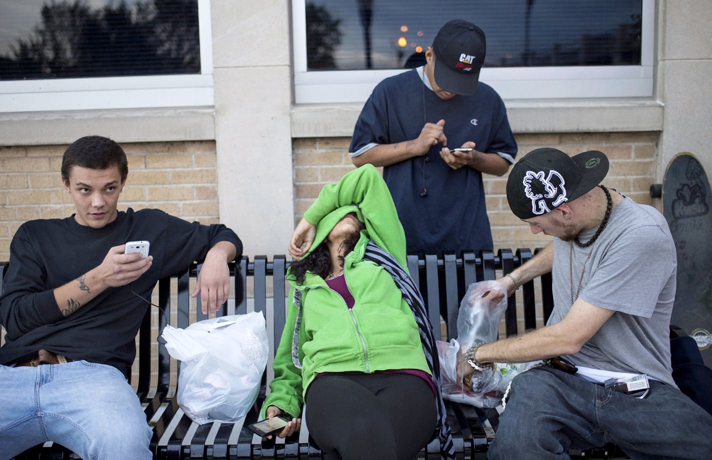 Hope 4 Youth: Suburbs across the metro are opening an array of new services for young people facing homelessness. From left, Deante Brown, Yana Miller, J.D. (last name withheld) and Stephen Rose, who use Hope 4 Youth&#x2019;s drop-in center in Anoka, passed time on Thursday in the suburb.