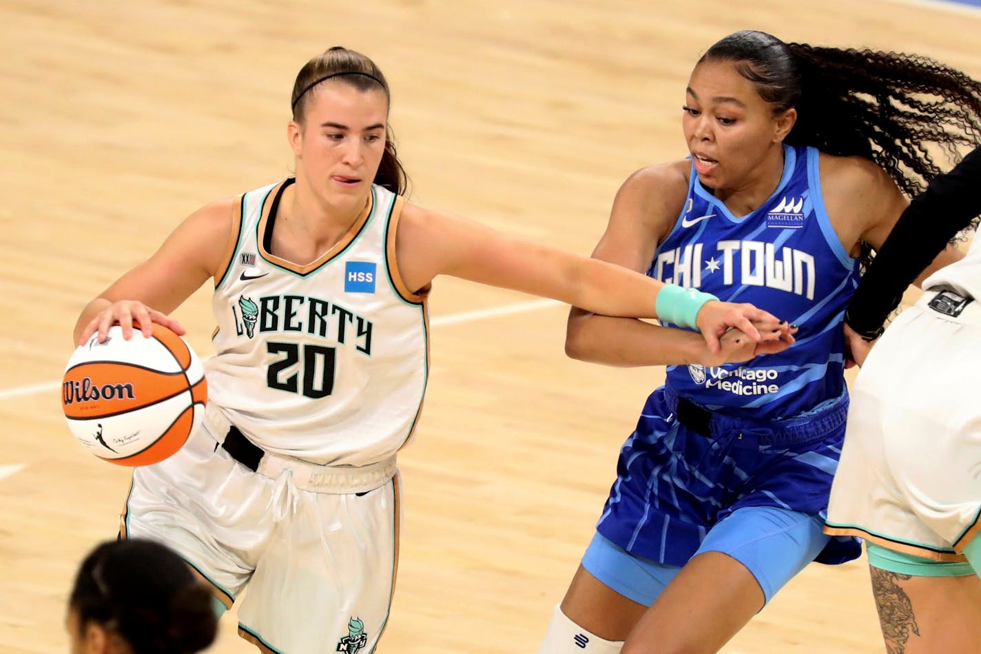 New York Liberty guard Sabrina Ionescu, left, tries to get past Chicago Sky guard Stephanie Watts, right, during a WNBA basketball game Sunday, May 23, 2021, in Chicago. (AP Photo/