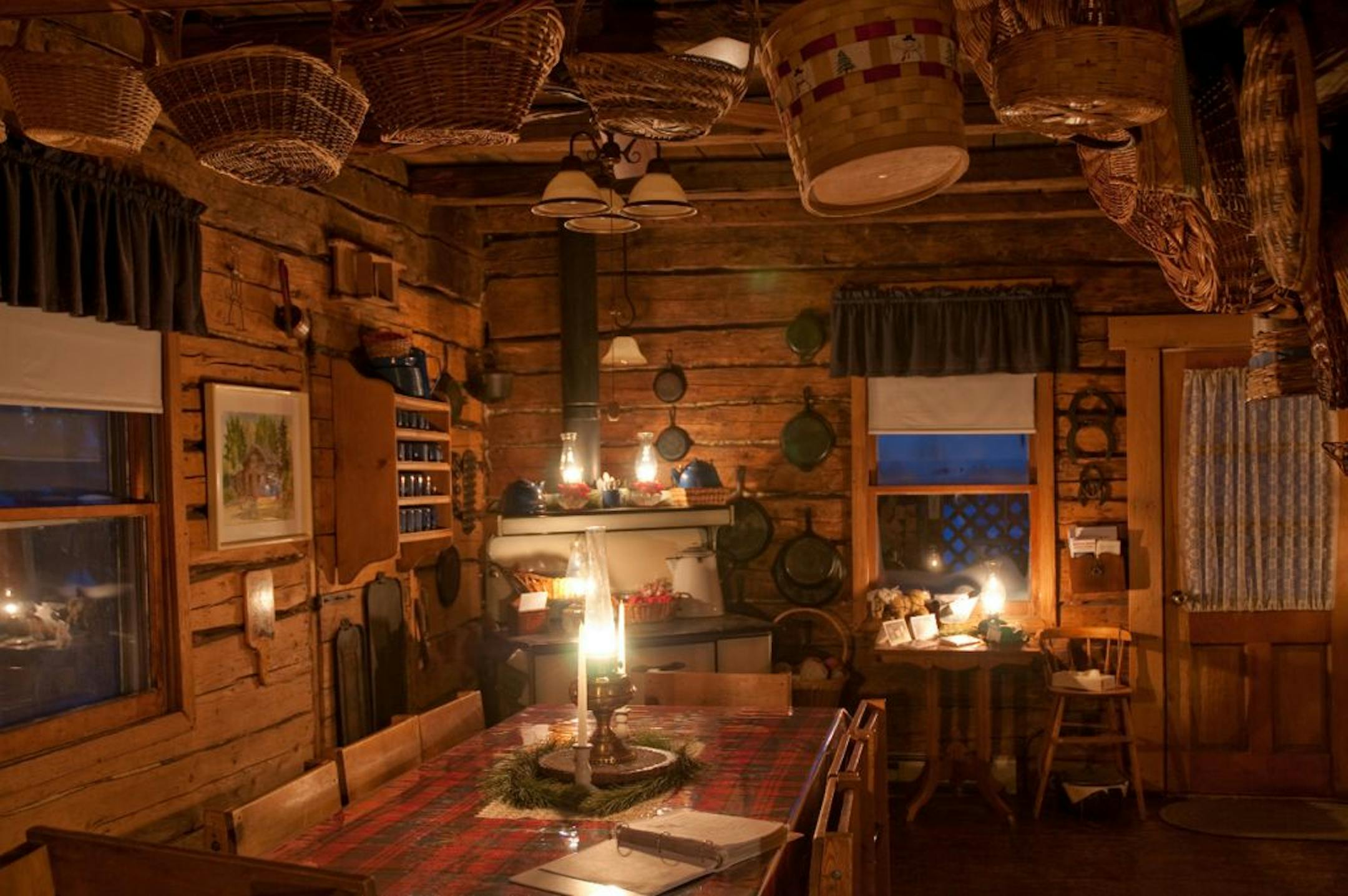 A wood-burning stove warms visitors to the Patten family homestead, a 1907 Finnish cabin.