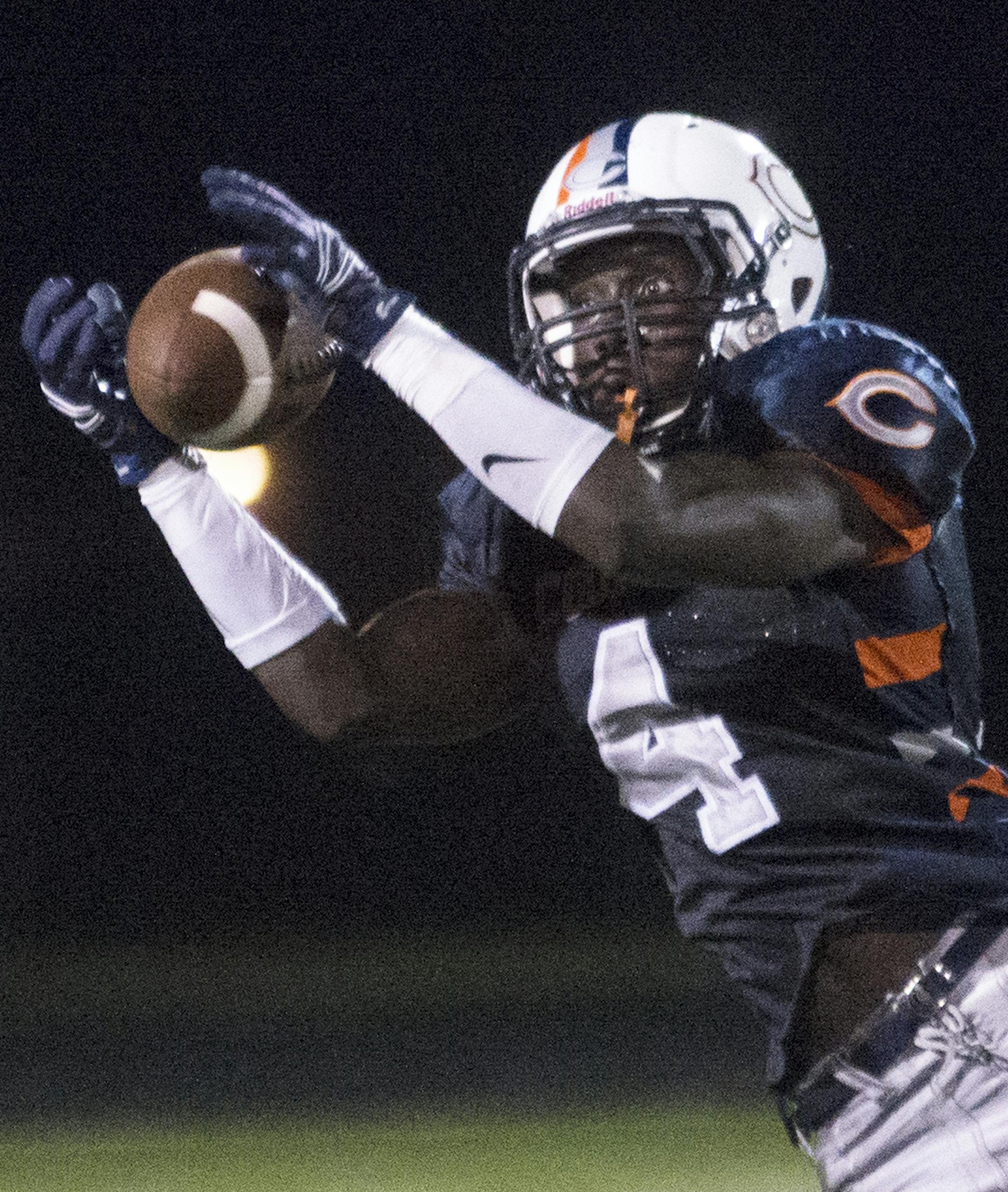 Cooper's Moses Nyangacha picks off an Armstrong pass during the third quarter, Friday, Sept. 3, at Cooper High School. ] (Matthew Hintz, 0903015, New Hope)