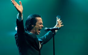 Nick Cave led the Bad Seeds through eight dramatic songs from their new album, "Wild God," at the Armory in Minneapolis on Sunday.