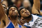 Timberwolves center Karl-Anthony Towns, right, fouled 76ers center Jahlil Okafor as they were going for a rebound under the Wolves' net in the second 