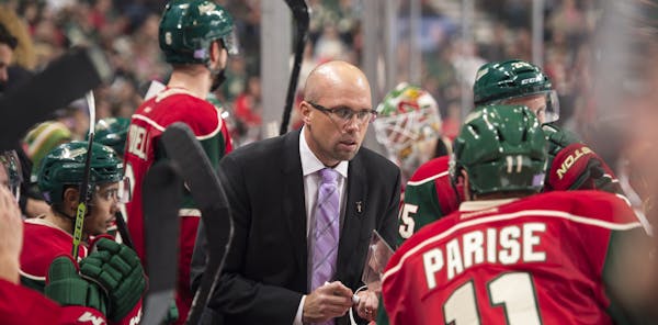 Minnesota Wild head coach Mike Yeo talked to left wing Zach Parise (11) during a break in action during the third period Tuesday. ] (AARON LAVINSKY/ST
