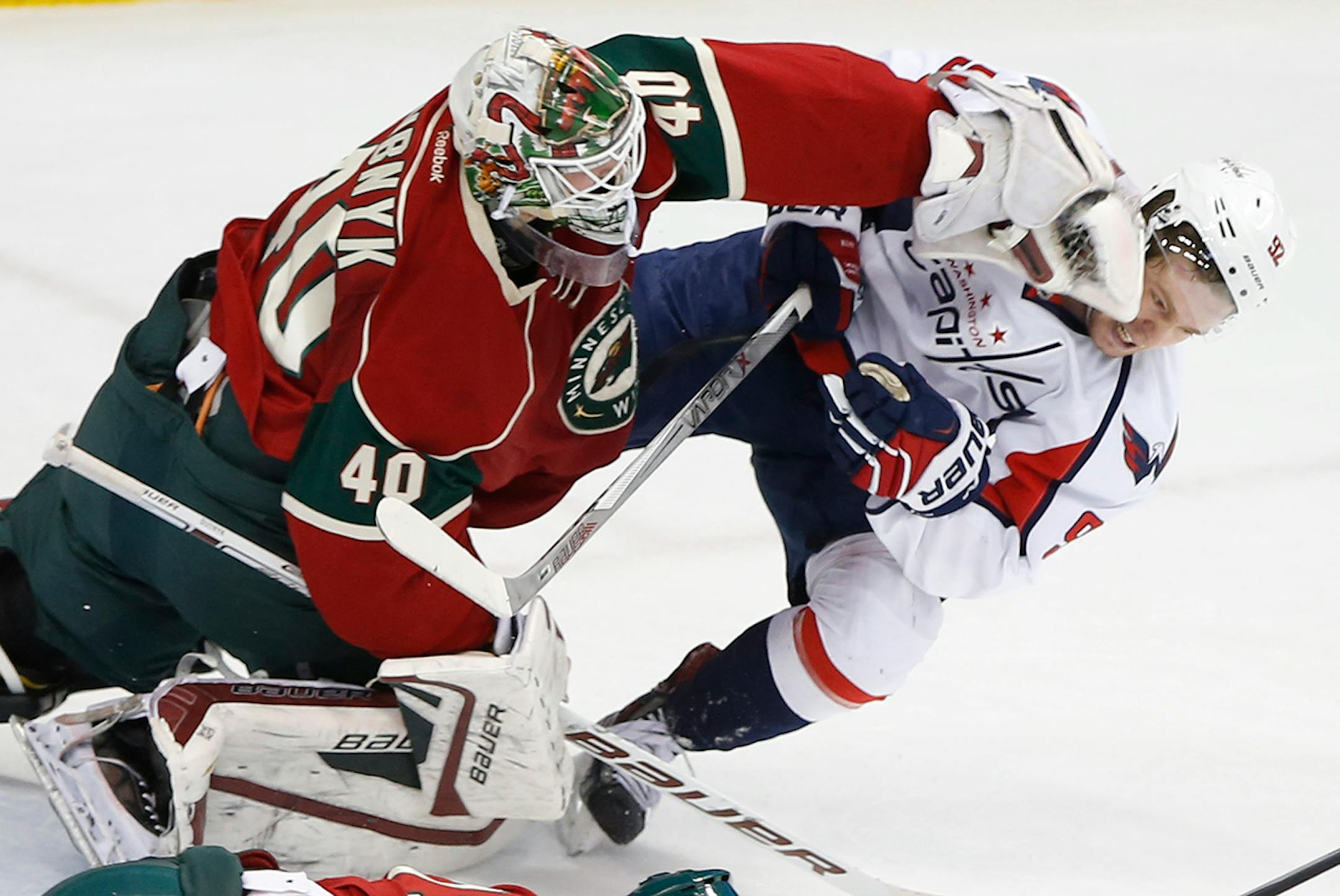 At the Xcel Energy Center in St. Paul in a game between Washington and Minnesota, goalie Devan Dubnyk(40) pushed Evgeny Kuznetsov(92) away but only after he scored.