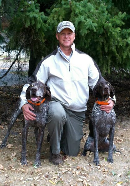 Dale Finck of Bertha, Minn., with his two German shorthairs, Cody and Sage.