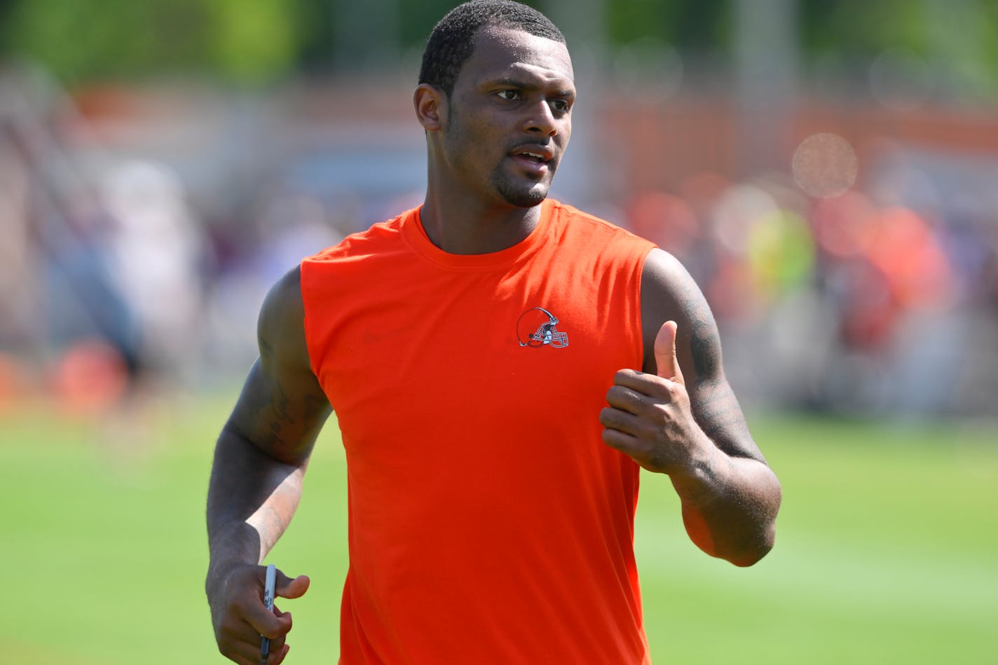 Cleveland Browns quarterback Deshaun Watson walks off the field after the NFL football team's training camp, Wednesday, Aug. 3, 2022, in Berea, Ohio. (AP Photo/David Richard)