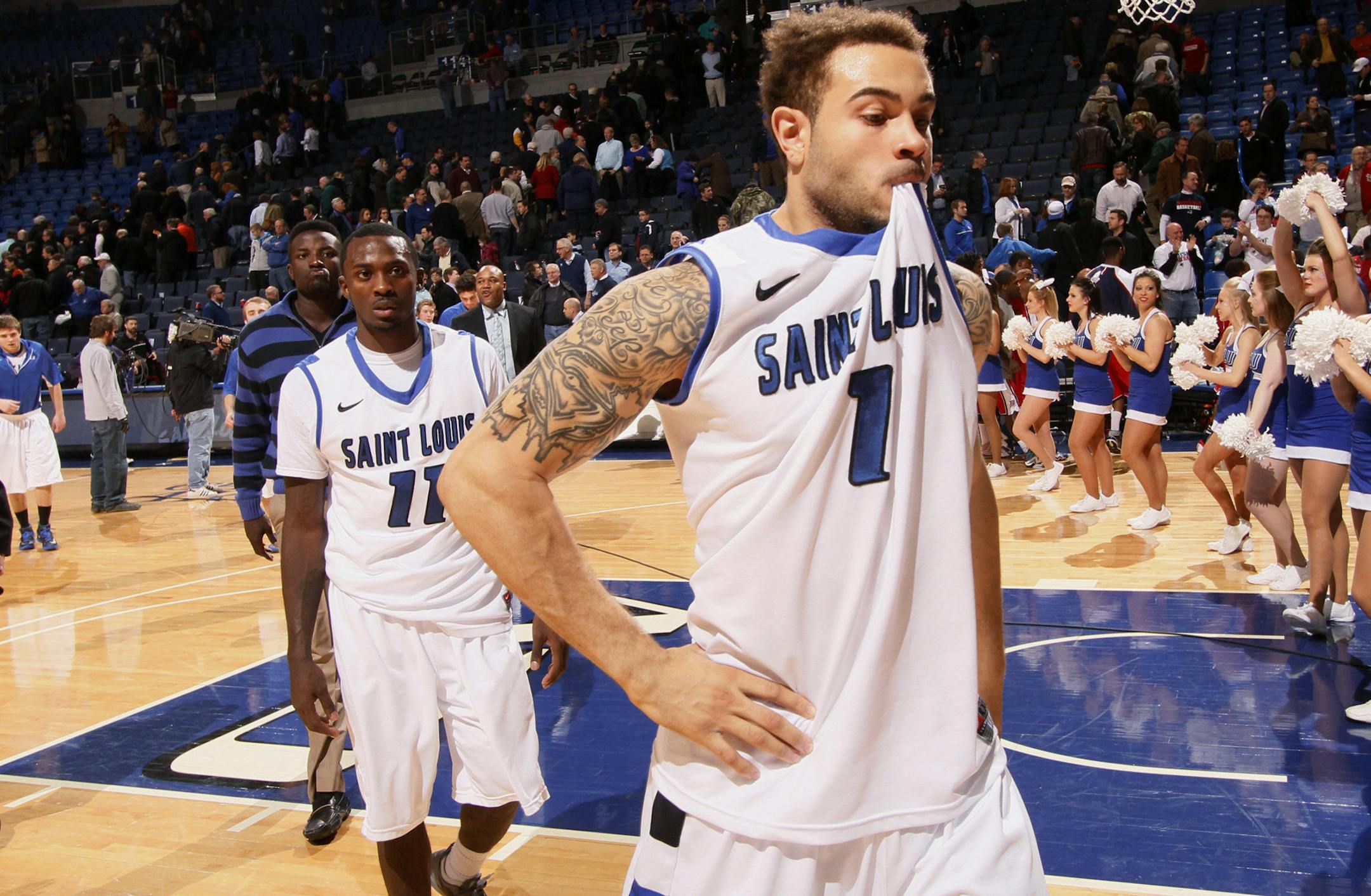 Saint Louis forward Grandy Glaze, right, and guard Mike McCall Jr. leave the court after an NCAA college basketball game against Duquesne on Thursday, Feb. 27, 2014, in St. Louis. Duquesne won 71-64. (AP Photo/St. Louis Post-Dispatch, Chris Lee) EDWARDSVILLE OUT ALTON OUT
