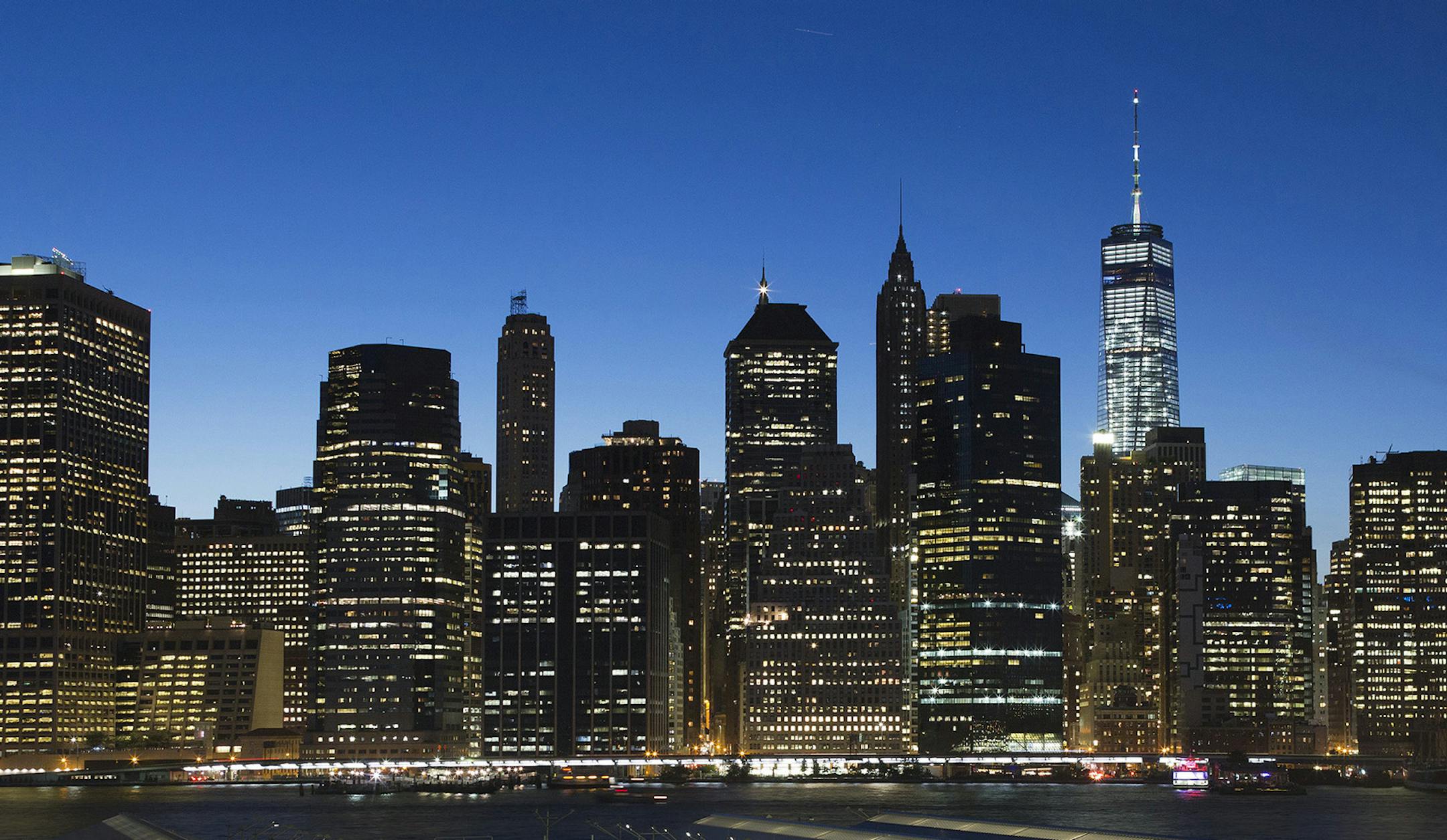 One World Trade Center, center right, towers above the lower Manhattan skyline, Friday, Aug. 28, 2015 in New York. (AP Photo/Mark Lennihan)
