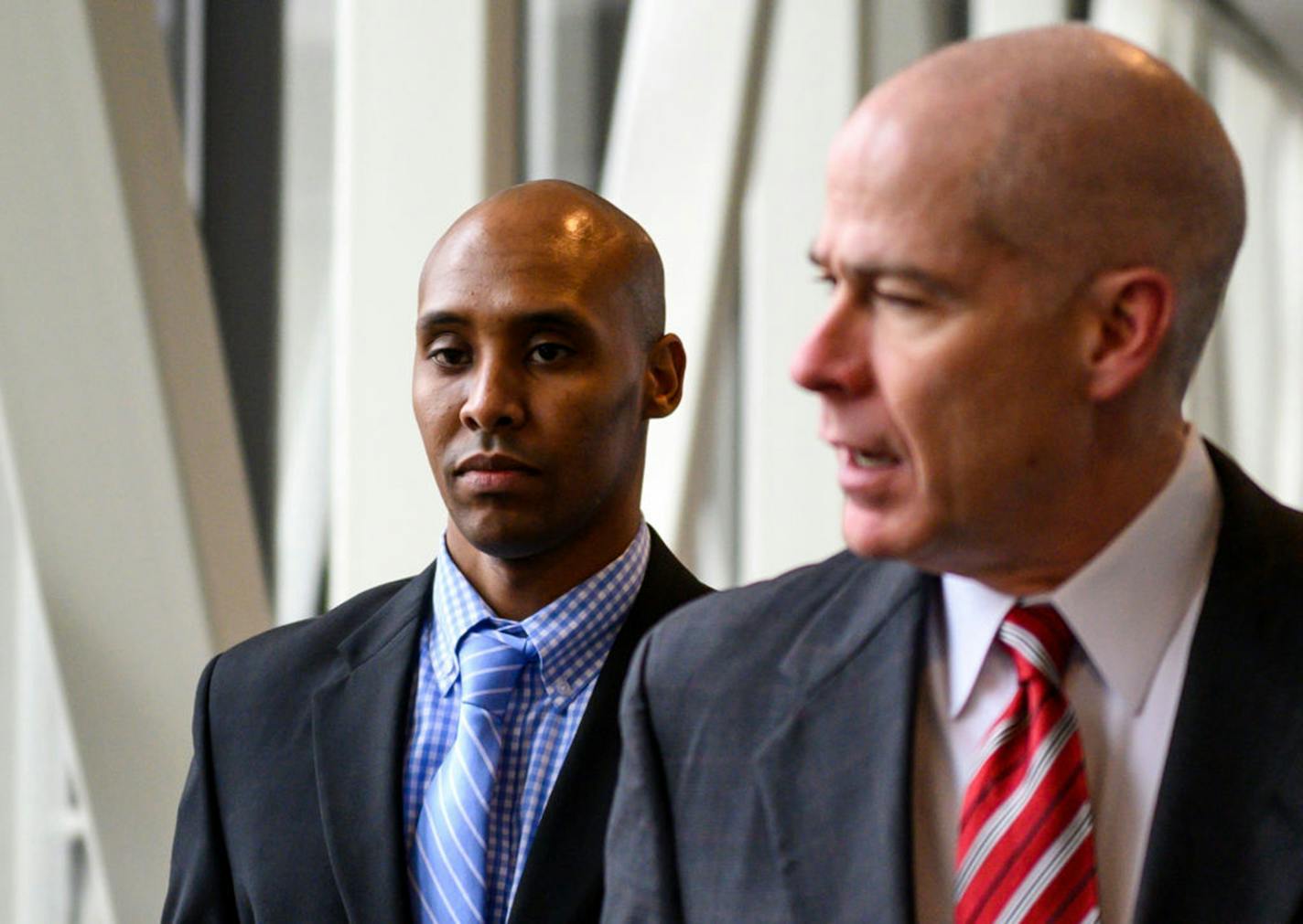 Former Minneapolis police officer Mohamed Noor (L) and his attorney Thomas Plunkett leave the Hennepin County Government Center on April 30, 2019 in Minneapolis, Minnesota. (Stephen Maturen/Getty Images/TNS) ORG XMIT: 1312251