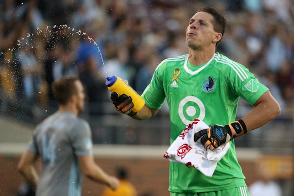 Minnesota United goalkeeper Bobby Shuttleworth (33) sprayed water as he took his position in goal prior to the start of the first half.