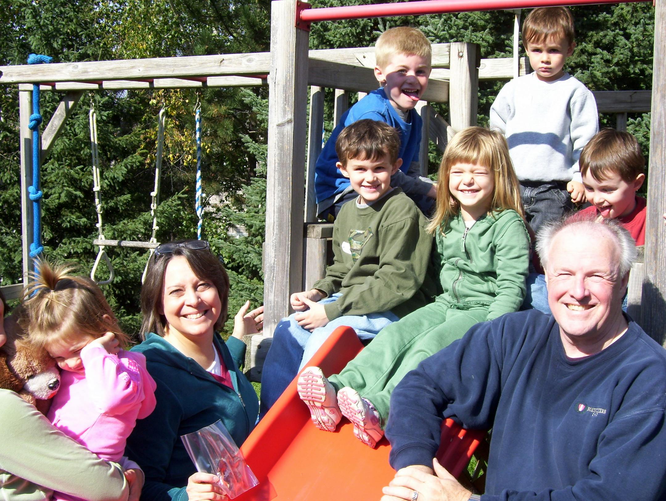 Gary and Jennifer Jarvis of Burnsville with their six grandchildren before the heart attack that Gary barely survived.