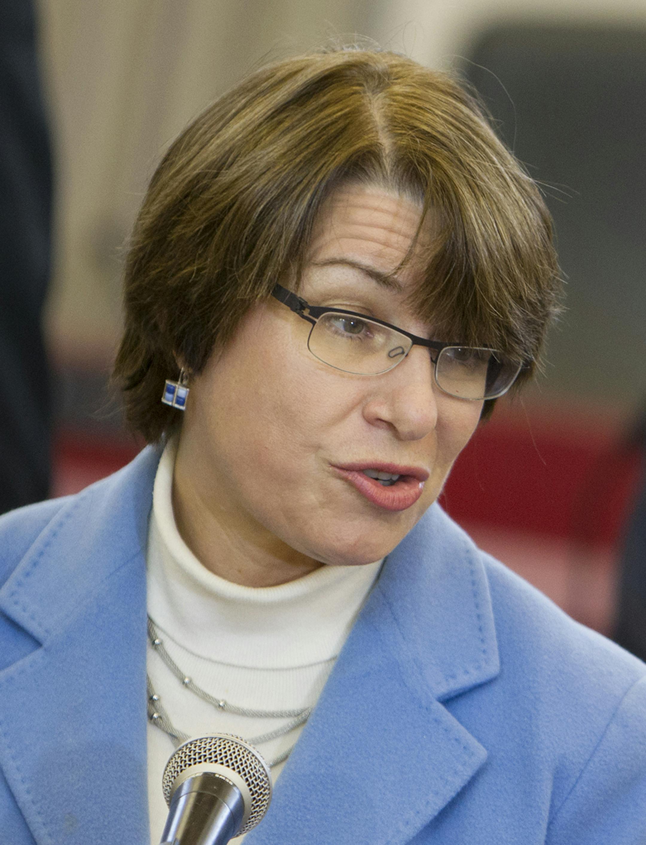 U.S. Senator Amy Klobuchar speaks to guests and media before awarding the Purple Heart to Vietnam veteran Fred Jenness after a 44-year delay at Golden Valley City Hall December 23, 2013. (Courtney Perry/Special to the Star Tribune) ORG XMIT: MIN1312231312593476