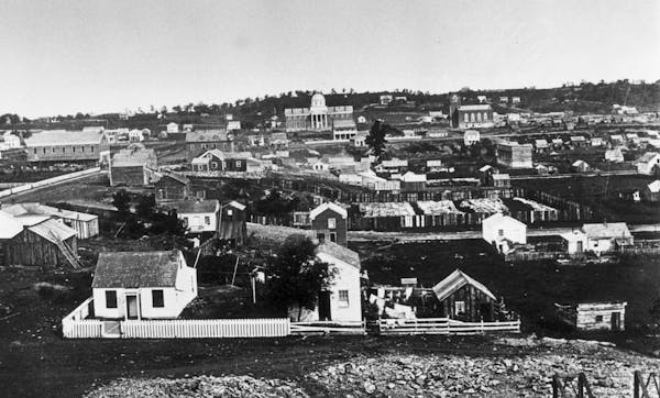 St. Paul as photographed in the 1850s. The Territorial Legislature met in the state’s first capitol, the domed building in the background.