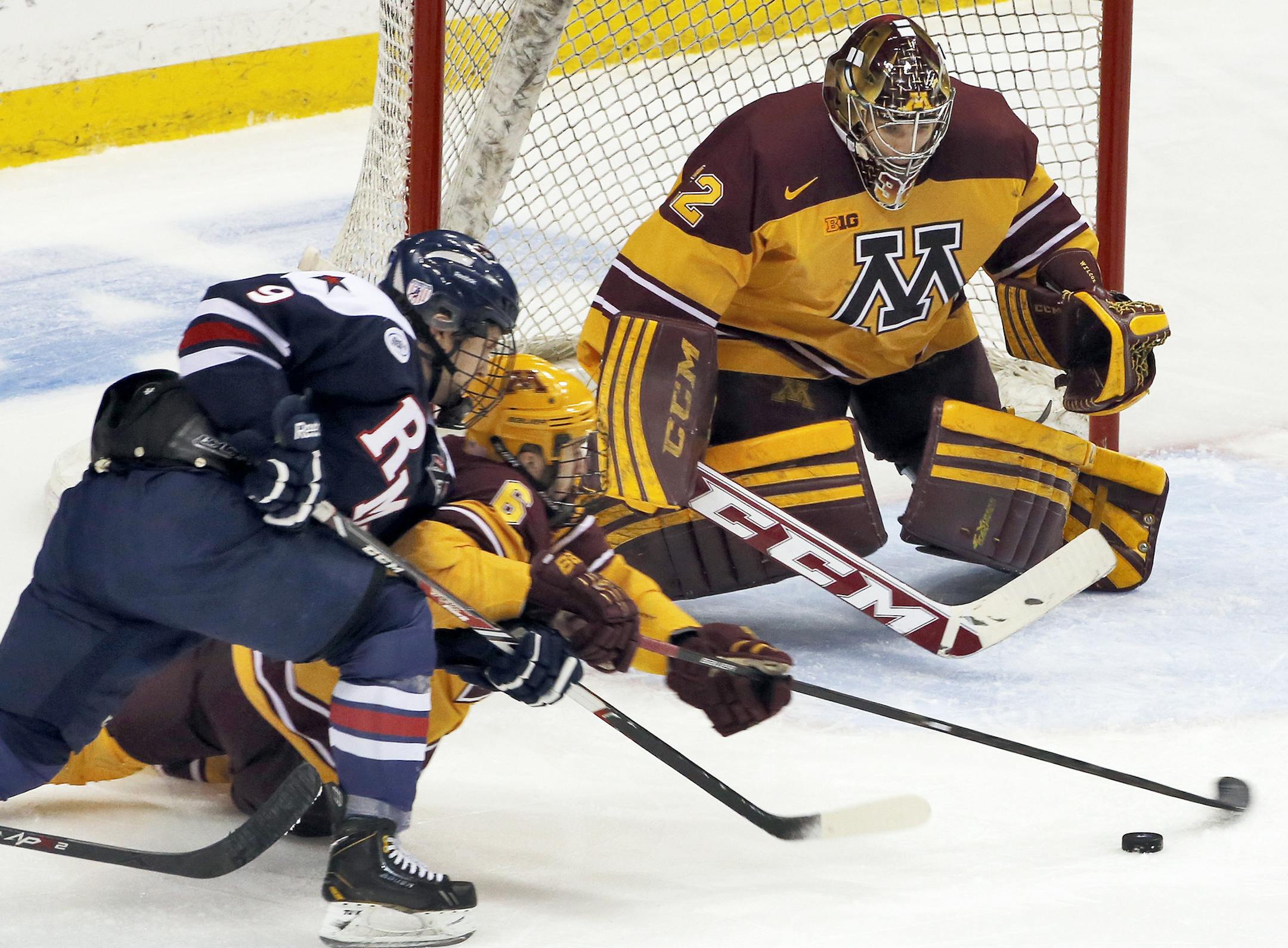 Minnesota defenseman Jake Parenteau (6) helped out goalie Adam Wilcox in front of the net. ] Minnesota Gophers vs. Robert Morris Colonials West Regional Hockey Tournament. (MARLIN LEVISON/STARTRIBUNE(mlevison@startribune.com)