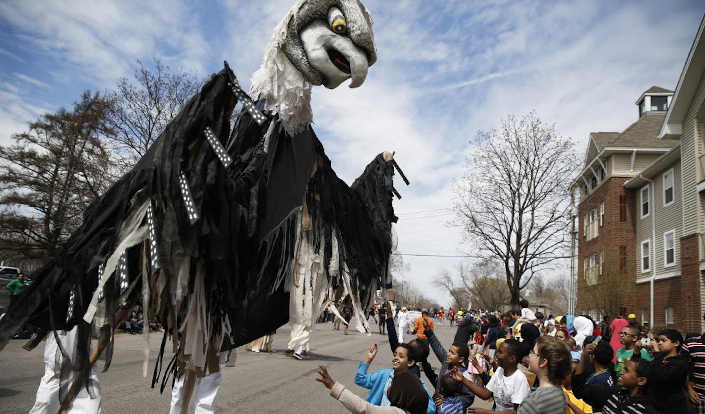 A giant bird puppet at the 2013 Mayday parade in Minneapolis, The annual event is sponsored by Heart of the Beast Puppet and Mask Theatre, which faces a financial shortfall as its fiscal year ends.