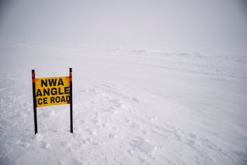 A sign marking the Northwest Angle Ice Road sat on the side of the road on Lake of the Woods on February 9, 2021. 