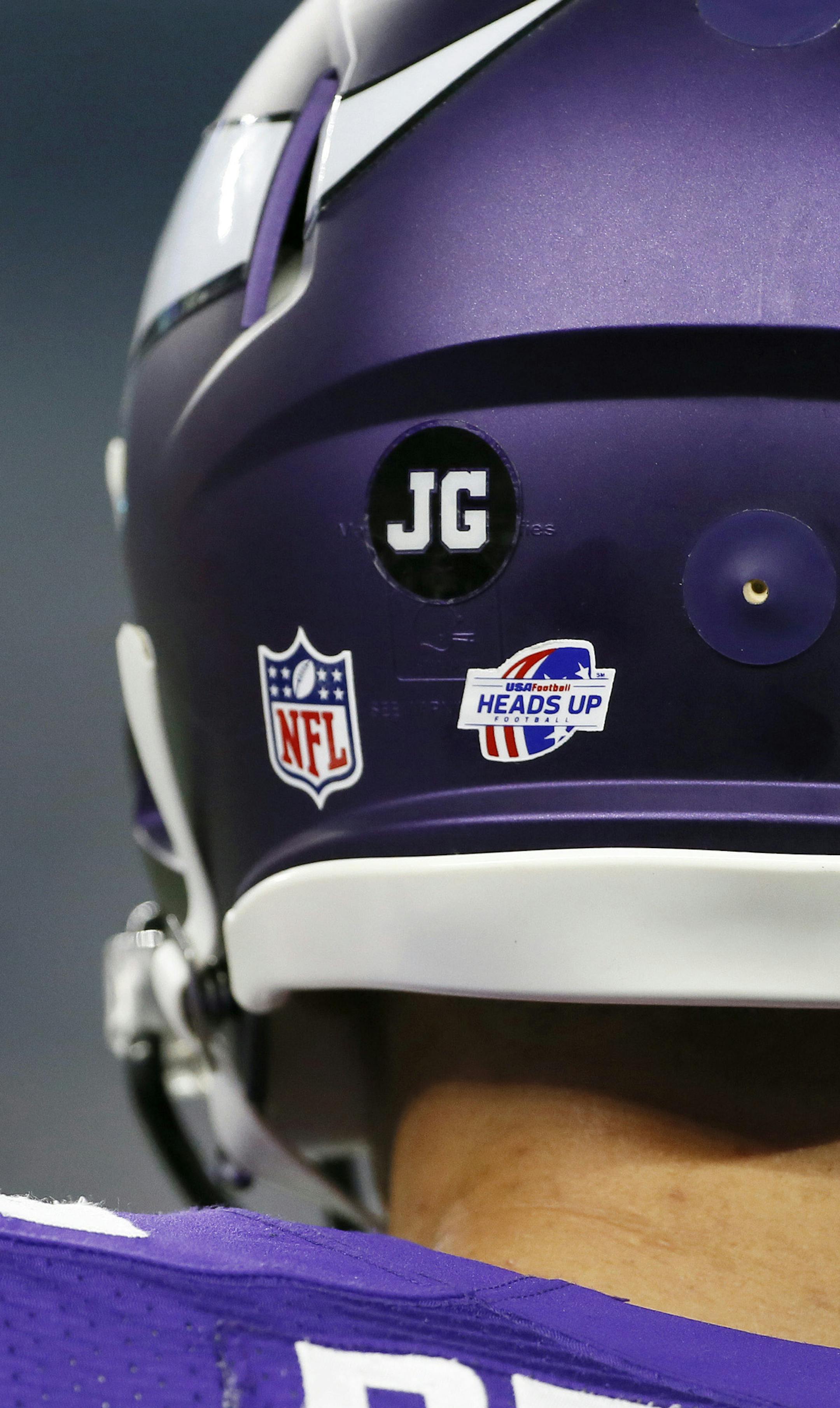 Minnesota Vikings linebacker Brian Peters (45) wears a sticker on his helmet with the initials of Jeramy Gruber during the first half of a preseason NFL football game Saturday, Aug. 29, 2015, in Arlington, Texas. Gruber is the construction worker died this week when he fell about 50 feet at the construction site of the Vikings' new stadium being built in Minnesota. (AP Photo/Tony Gutierrez)
