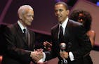 Sen. Barack Obama, D-Ill., right, receives the Chairman's Award from Julian Bond, chairman of the NAACP, at the 36th NAACP Image Awards in Los Angeles
