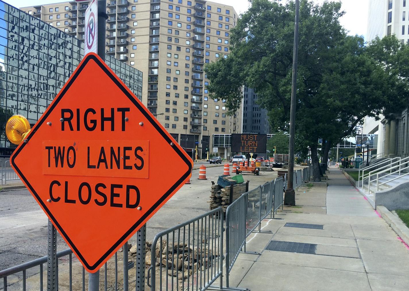 Road crews worked Sunday [Aug. 14] on Washington Av. Near S. 2nd St. in downtown Minneapolis, along a six-block stretch of the street that will be under construction for the next three months, a period including multiple events at the new U.S. Bank Stadium nearby. Photo by Claude Peck