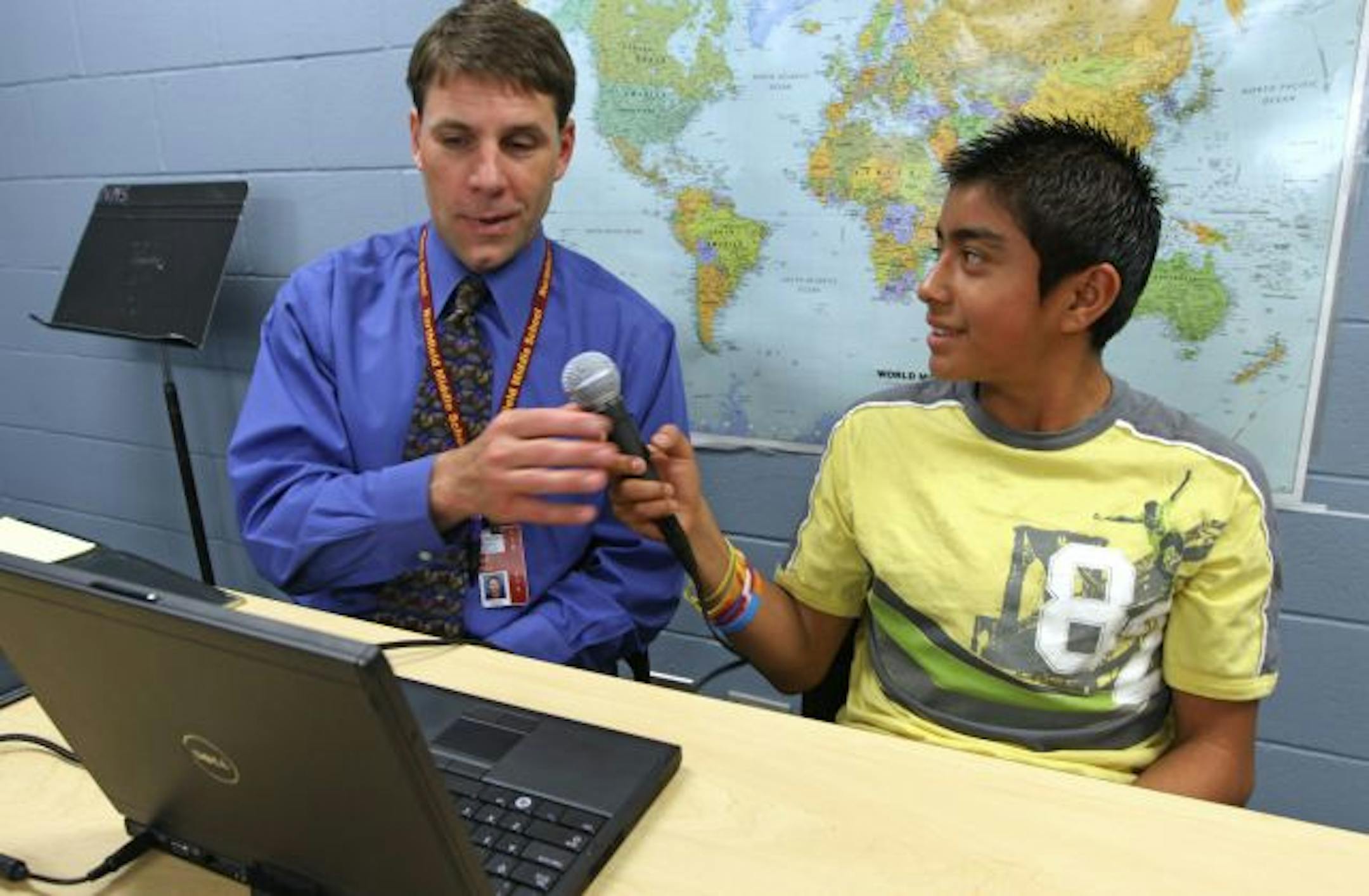 Northfield Middle School Principal Jeff Pesta worked with student Jose Alfredo Bravo-Barojas on a laptop using SpeechGear's real-time English-Spanish translator. A Northfield company, SpeechGear, has created a program that transcribes what is being said aloud.