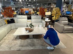 A shopper pauses at a display in a furniture store Sunday, June 2, 2024, in Englewood, Colo. On Wednesday, June 12, 2024, the Labor Department issues 