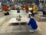 A shopper pauses at a display in a furniture store Sunday, June 2, 2024, in Englewood, Colo. On Wednesday, June 12, 2024, the Labor Department issues 