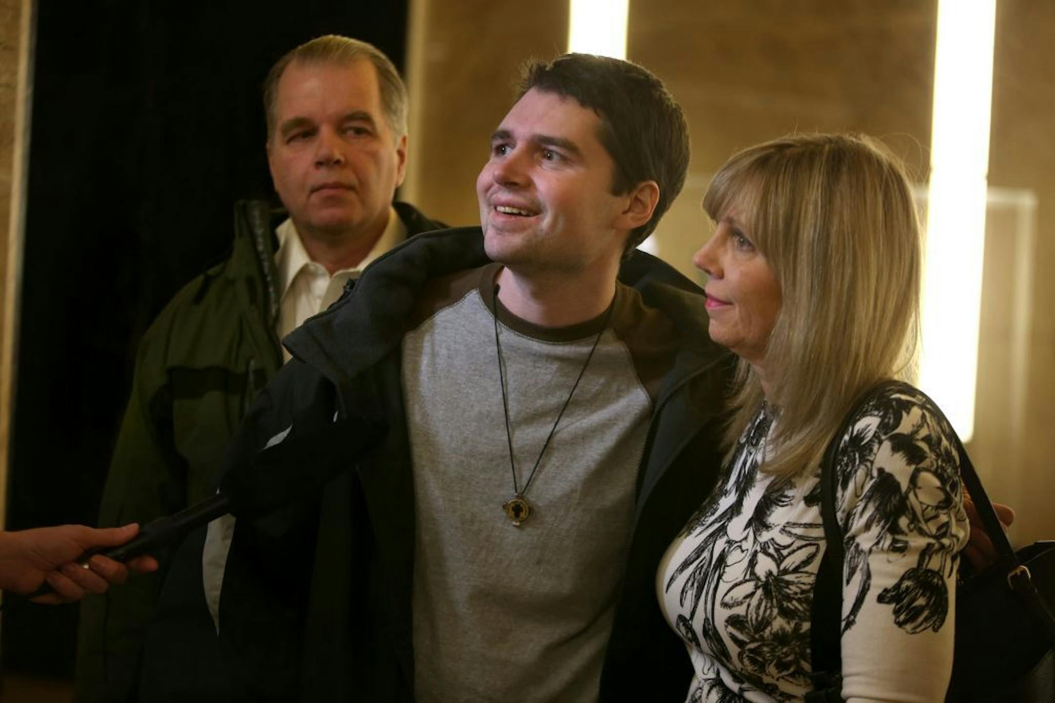 Beating victim Ray Widstrand was all smiles with his parents Peter and Linda Widstrand after the 16-year sentencing of Cindarion Butler at the Ramsey County Courthouse, Tuesday, March 25, 2014 in St. Paul, MN.