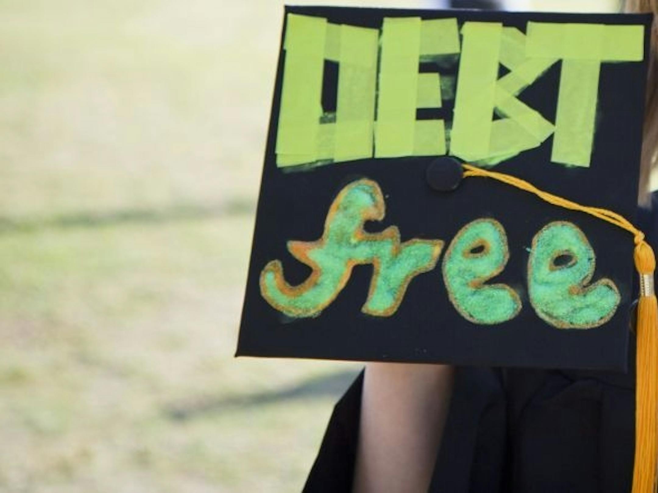 This 2014 photo provided by The University of Texas at Dallas shows, a cap worn by Laurel Mohrman at her graduation from the University of Texas at Dallas. She decorated the mortarboard with the words, "DEBT free," to celebrate her lack of college debt. Any commencement is likely to include some students who've decorated their mortarboards with everything from thank-yous to inspirational messages.