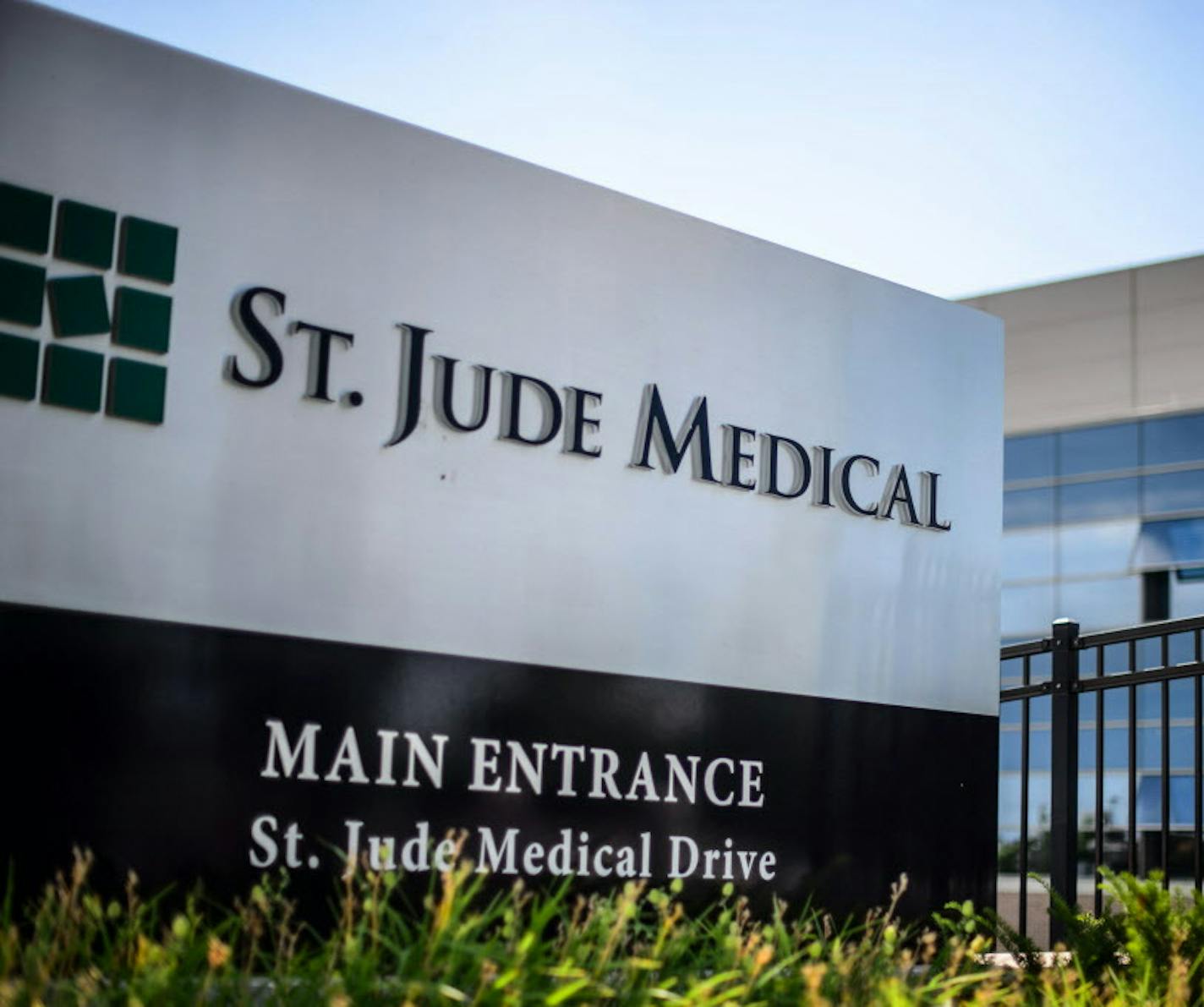 This Wednesday, July 22, 2015, photo shows St. Jude Medical corporate headquarters, in Little Canada, Minn., just north of St. Paul. Abbott Laboratories will spend $19.3 billion to buy St. Jude Medical Inc. in a cash-stock deal that aims to strengthen the medical device maker's stake in cardiovascular care, the companies announced Thursday, April 28, 2016. The combined company will offer devices in nearly every area of cardiovascular care, competing directly with industry leaders Medtronic Inc.