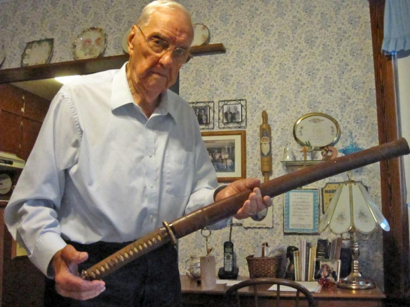 Orval Amdahl, owner of the Japanese sword that he is returning to the grandson of its owner after he had brought it home after World War II. The sword will be returned in a ceremony in St. Paul on Saturday marking International Peace Day. Photo: Jim Adams / Star Tribune 9/17/2013