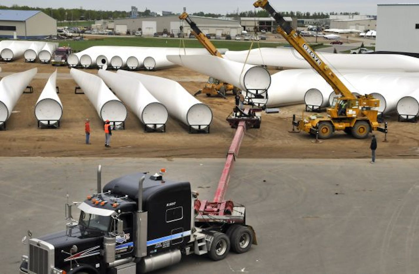 Two years ago, wind power was more of a going concern. Suzlon wind turbine blades that were each 150 feet long were moved into position for delivery to a new wind farm in Fort Bridger, Wyo.