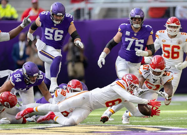Chiefs safety Bryan Cook (6) recovered a ball fumbled by Vikings tight end Josh Oliver (84) in the first quarter, Sunday, Oct. 8, 2023 in Minneapolis.