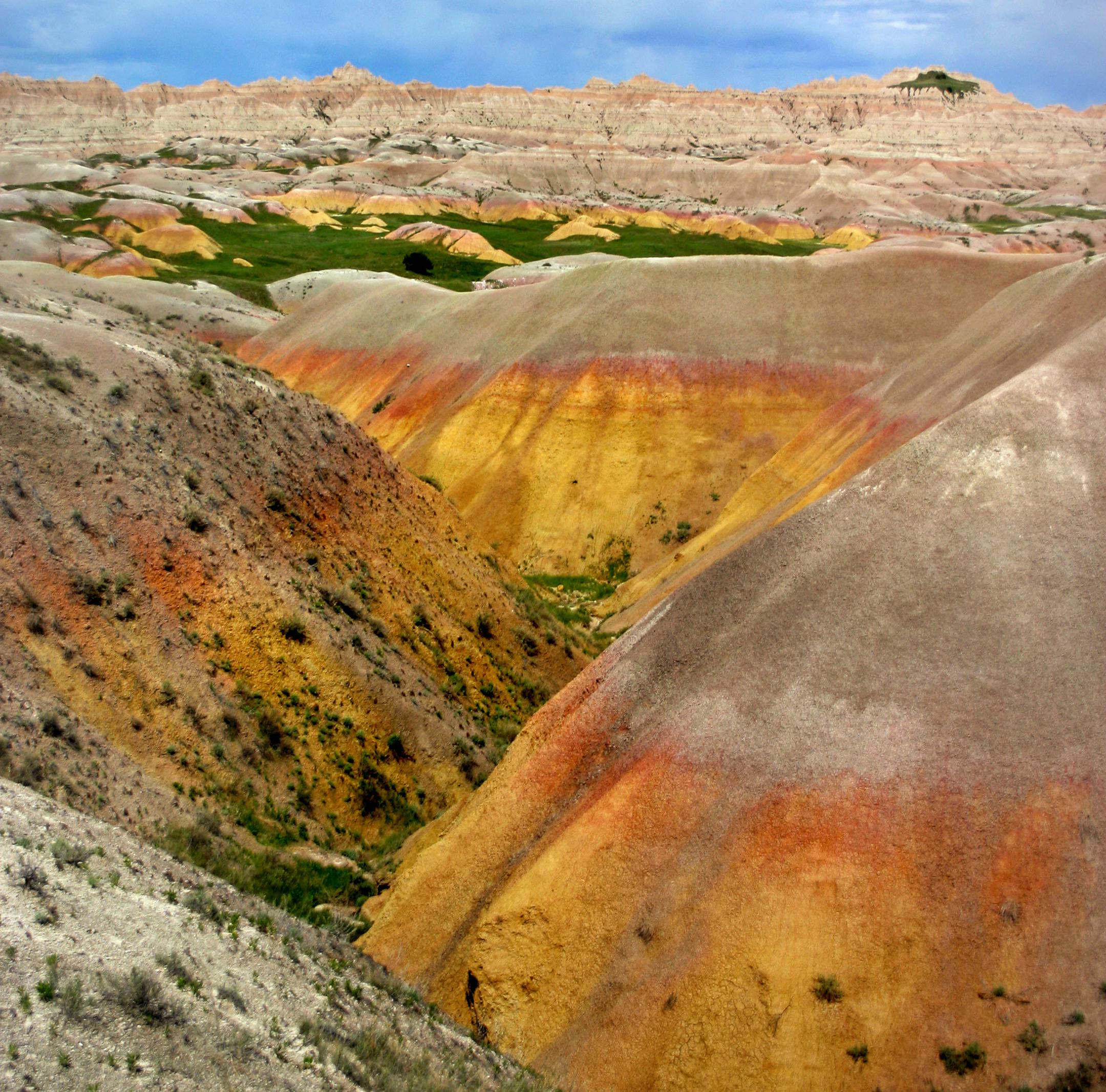 Visitors to Badlands National Park can witness a naturally occuring color palette of pinks and yellows on the rock faces as they drive the Badlands Scenic Loop route. (Kara Silva/Chicago Tribune/MCT)