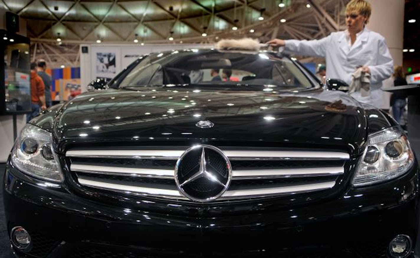 Kollen Boyd of Minneapolis polished a Mercedes Benz CL Class sedan at the Twin Cities Auto Show in the Minneapolis Convention Center. The auto show slogan is: Your License to Dream. Will it be just that in what has already been a dismal season for car dealers? With dealers pinning their hopes on the Auto Show, which begins March 21, we look at whether people will be just window-shopping, looking for bargains or doing some meaningful shopping? And what about the $3.75 billion in tax rebates and c