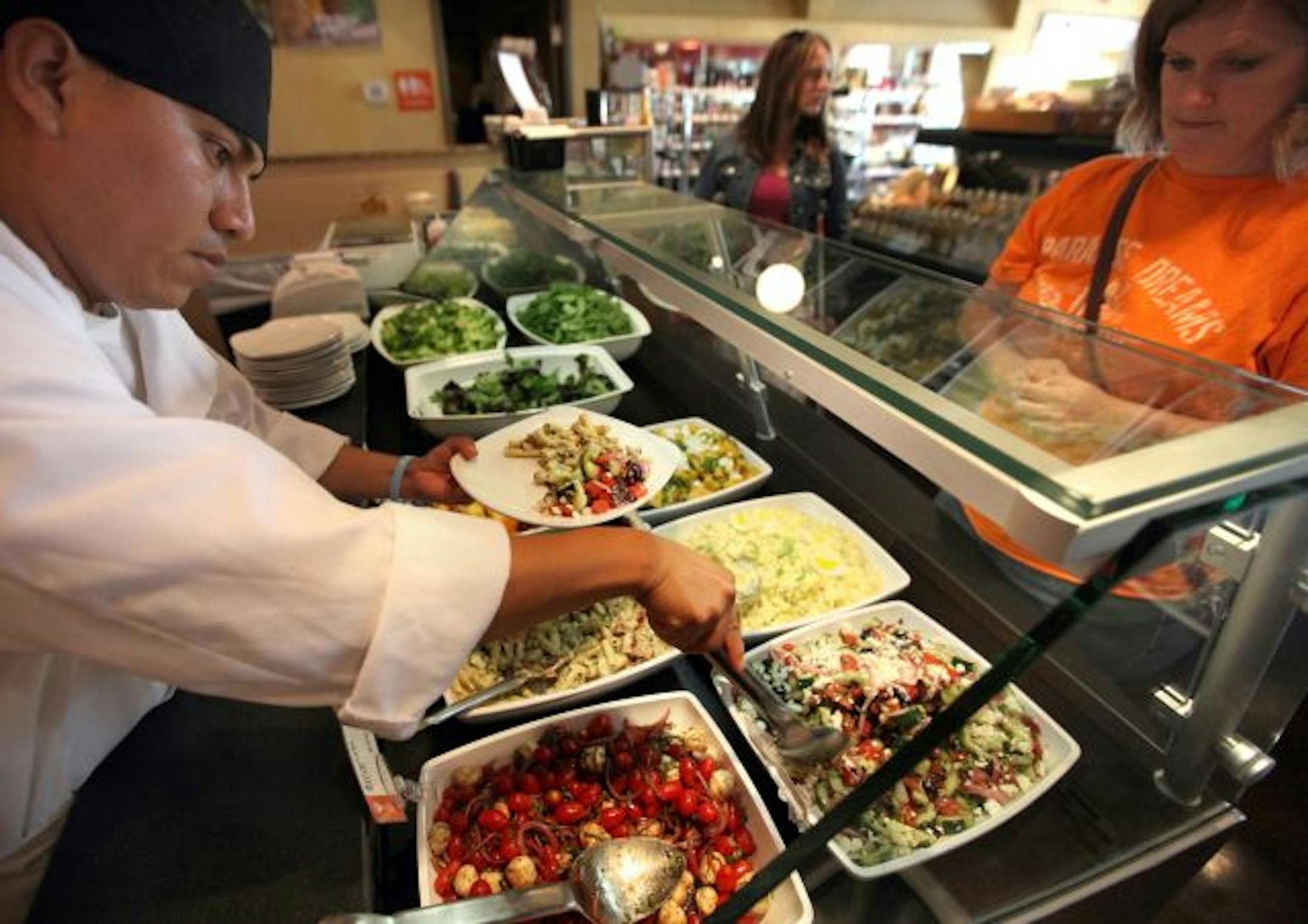 Make your own salad plate with the help of Rudy Resendiz at Pairings in Minnetonka. The counter-service restaurant also offers sandwiches, pizzas, cheese and meat plates, entrees and desserts. Diners can go next door to pay retail for an array of wine selections.