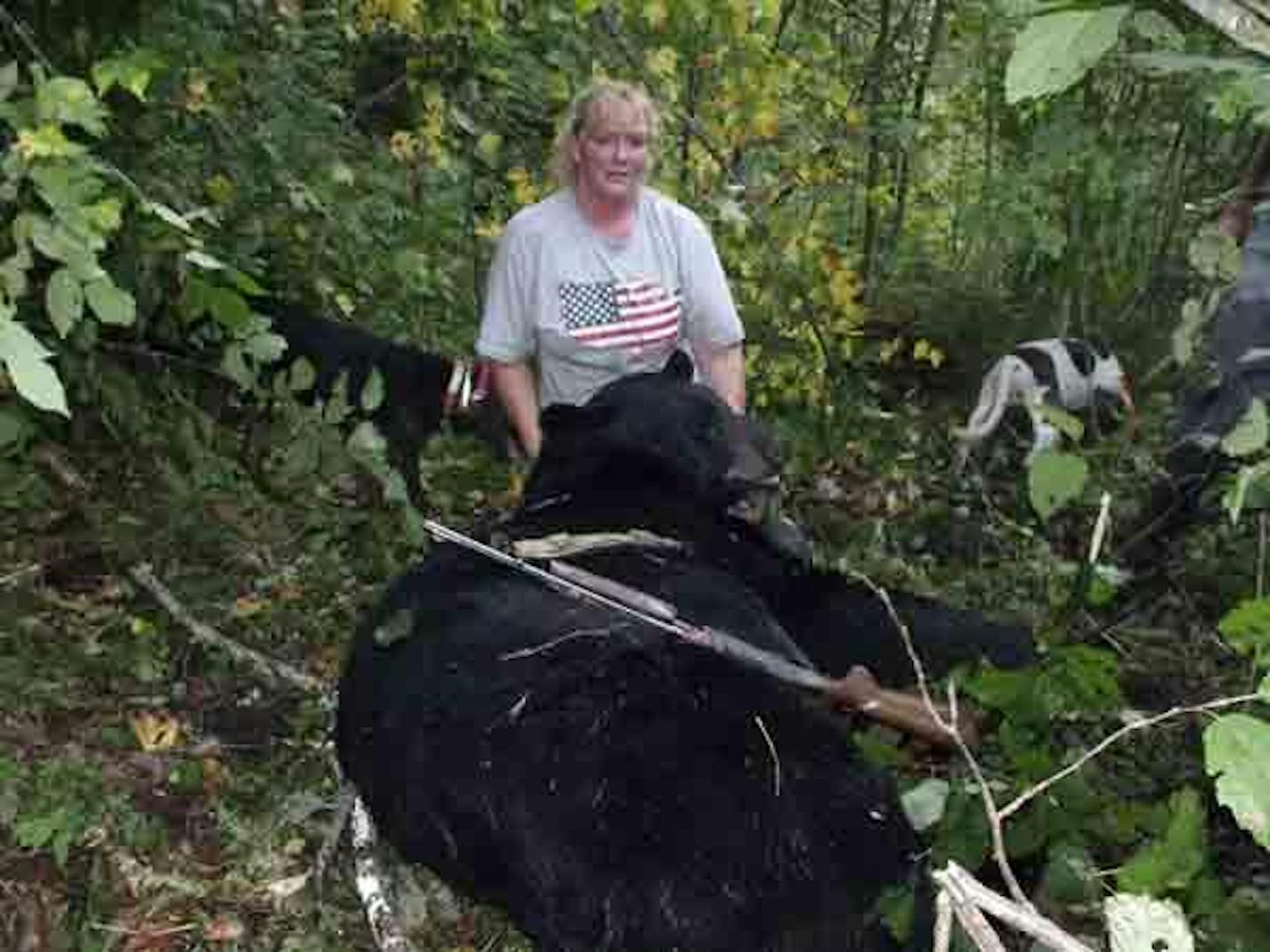 Rhonda Anderson of Serona, Wis., and her 658 pound black bear.