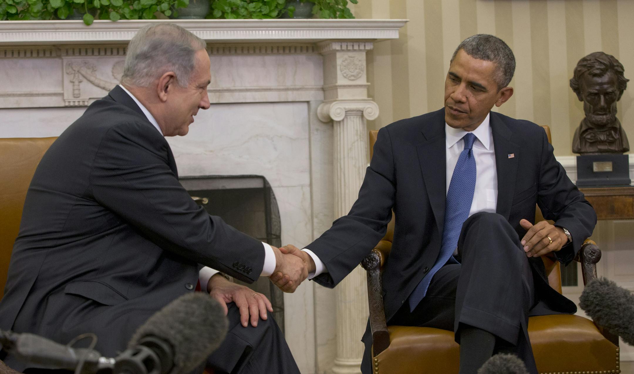 President Barack Obama and Israeli Prime Minister Benjamin Netanyahu shake hands during their meeting in the Oval Office of the White House in Washington, Monday, March 3, 2014. Seeking to keep a pair of delicate diplomatic efforts afloat, Obama will personally appeal to Netanyahu to move forward on peace talks with the Palestinians, while also trying to manage Israel's deep suspicion of his pursuit of a nuclear accord with Iran. (AP Photo/Pablo Martinez Monsivais)
