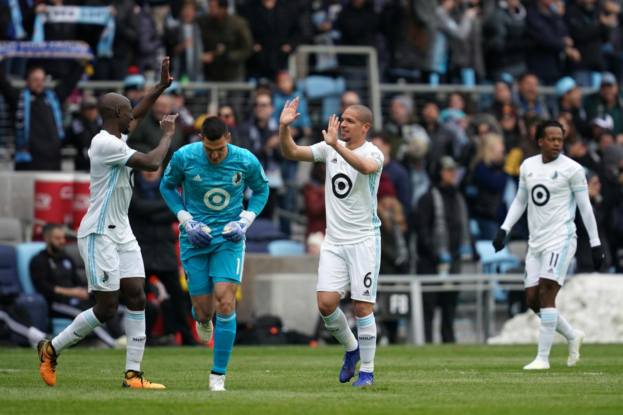 Minnesota United midfielder Osvaldo Alonso (6) celebrated with Minnesota United defender Ike Opara (3) after scoring the first Loon goal at Allianz Field in the first half.