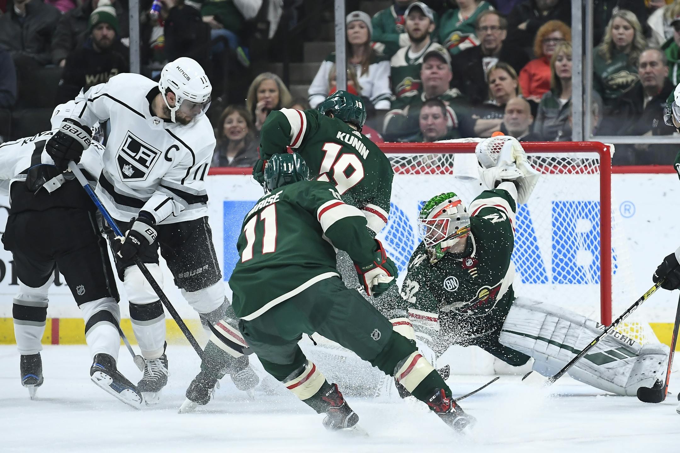 Minnesota Wild goaltender Alex Stalock (32) was unable to stop a goal-scoring shot by Los Angeles Kings left wing Ilya Kovalchuk (17), far left, in the second period, allowing the Kings to tie the game 1-1.