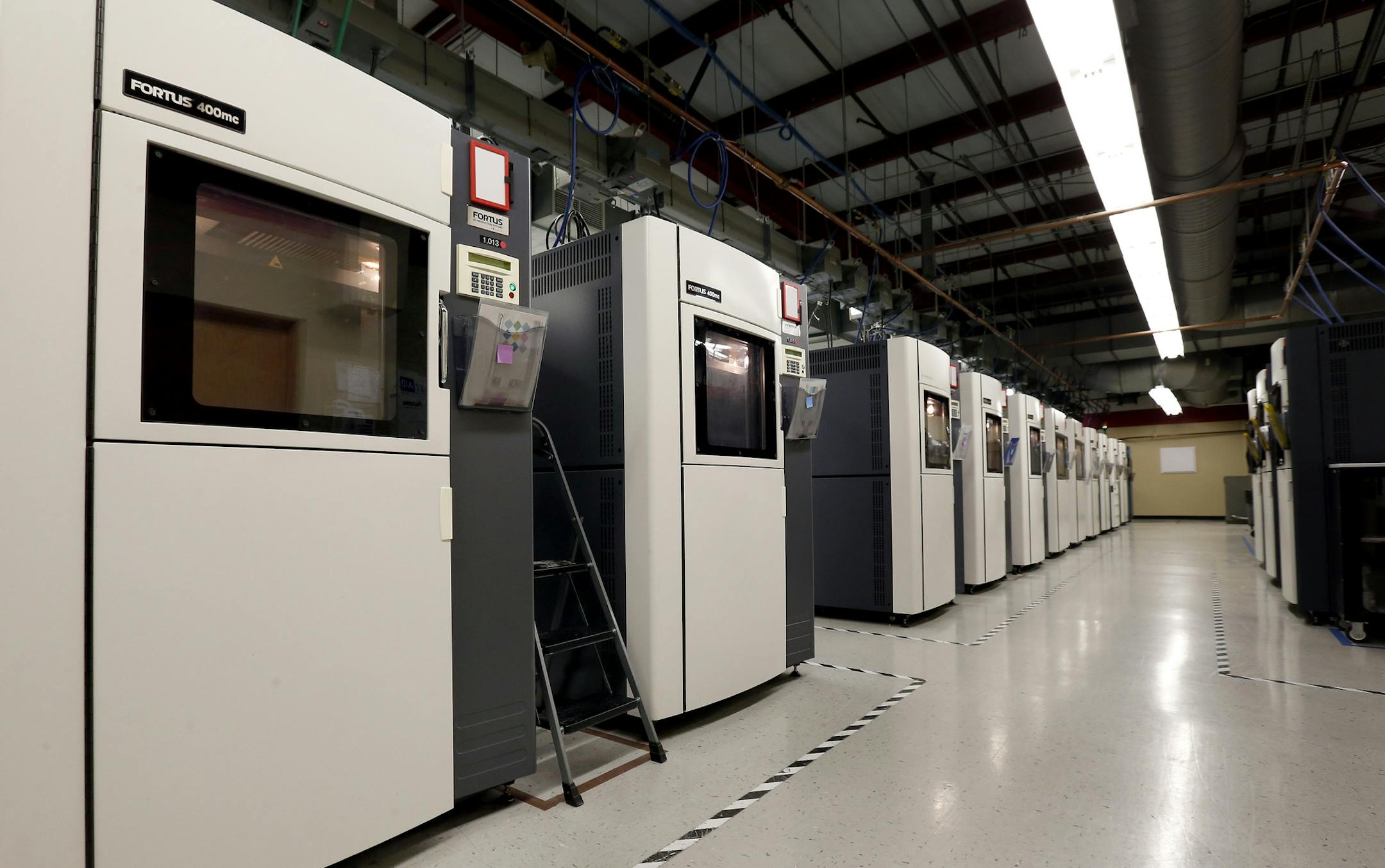 Rows of 3D printers were at work at RedEye by Stratasys in Eden Prairie. ] CARLOS GONZALEZ cgonzalez@startribune.com October 29, 2013, Eden Prairie, Minn., RedEye by Stratasys , 3-D printing plants