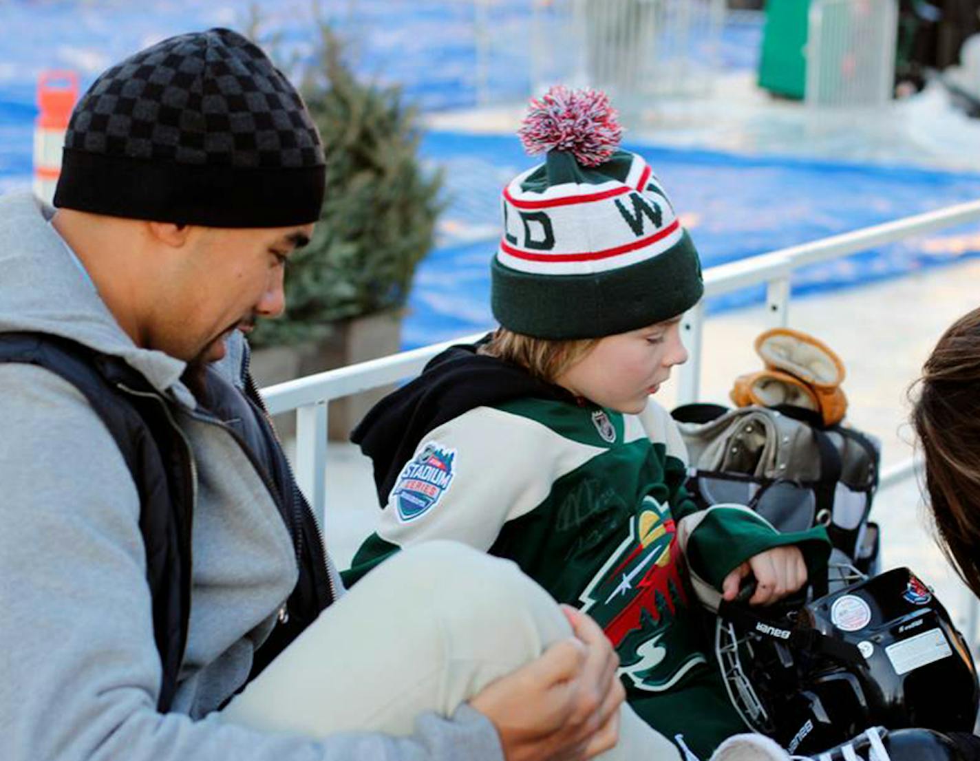 Matt Dumba with Ty Olson, 9. Photo from Minnesota Wild