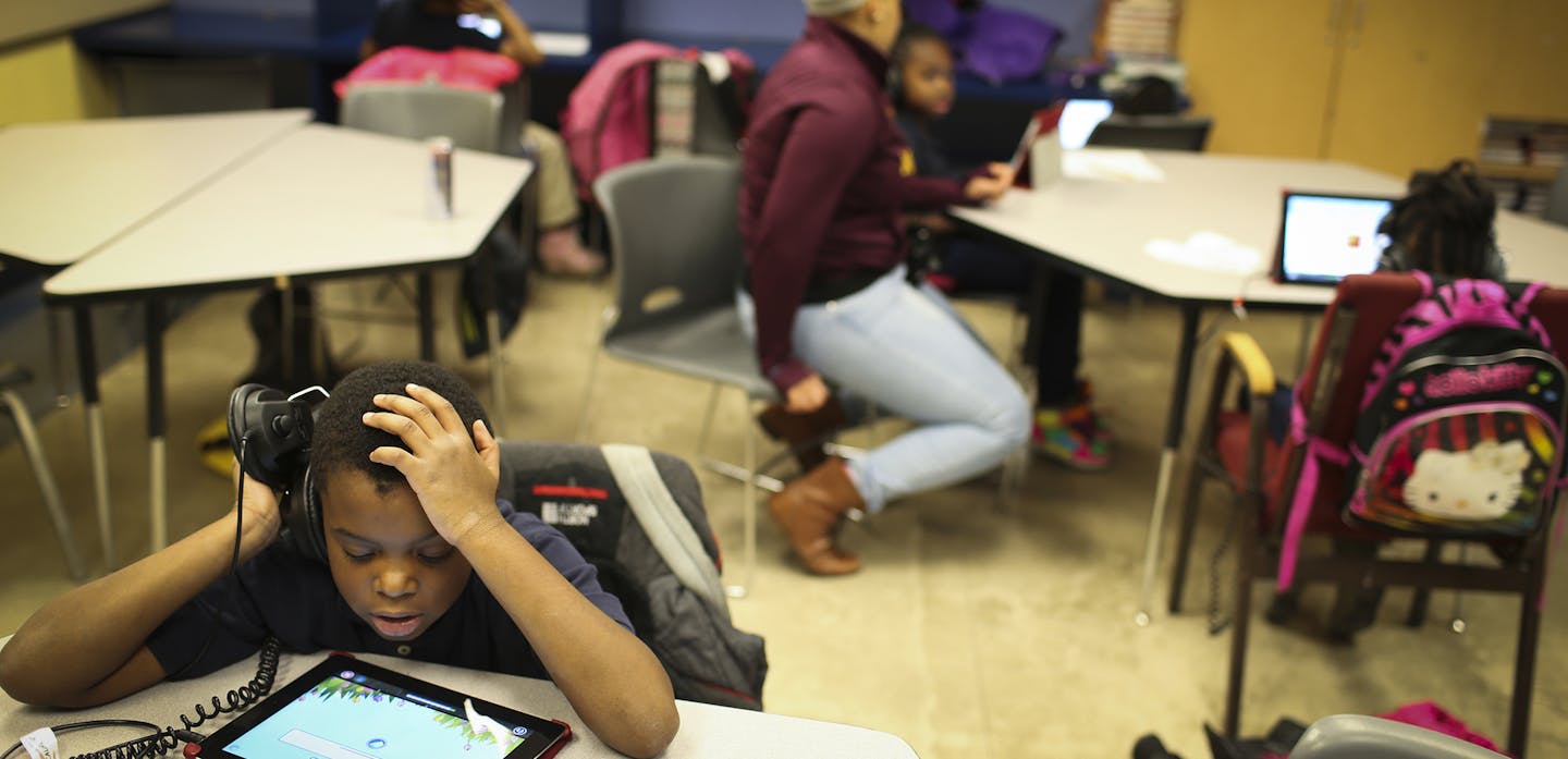 Qaiyim Beeks worked on a Lexia reading and writing iPad program during a Northside Achievement Zone after-school program at Plymouth Christian Youth Center on Tuesday, December 9, 2014. ] REN&#xc9;E JONES SCHNEIDER reneejones@startribune.com ORG XMIT: MIN1412091717110426