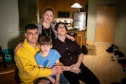 Clockwise from left; Mohammed Khuder, Olena Khuder, Ahmed Khuder, 15, and Yazan Khuder, 7, photographed at home in Minneapolis. Not pictured is their 