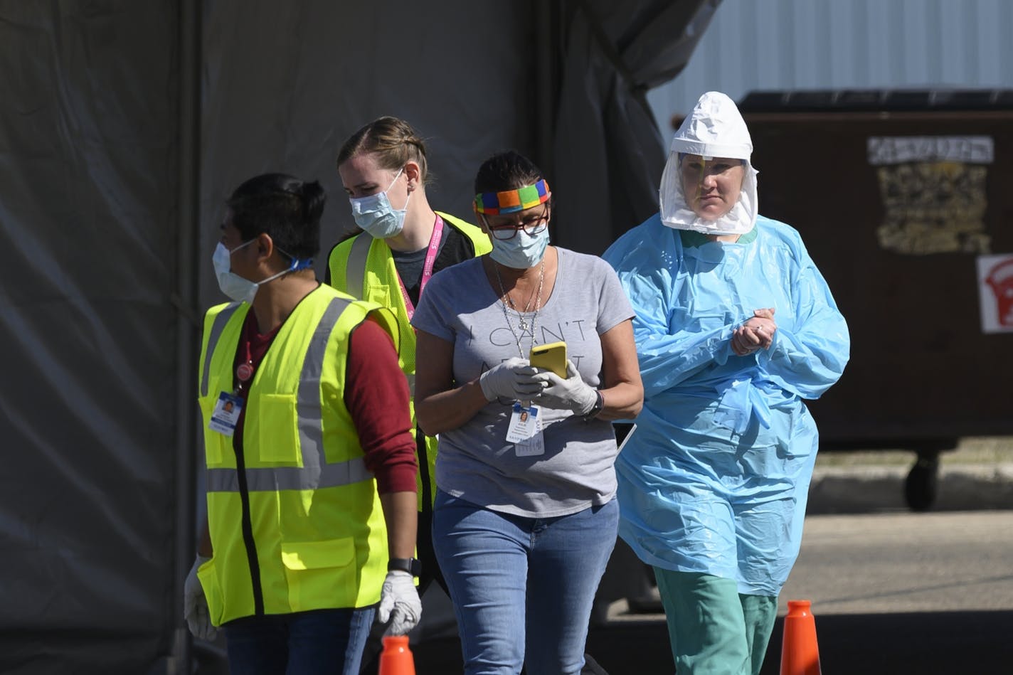 Medical workers administered drive-up COVID-19 tests Saturday outside the Sanford Worthington Clinic on April 18 in Worthington, Minn. State data have shown that black, Asian and Hispanic residents run disproportionate risks related to COVID-19.