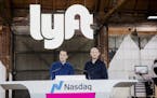 FILE -- John Zimmer, left, and Logan Green, the founders of Lyft, at a party celebrating the ride-hailing company&#x2019;s IPO, in Los Angeles, March 