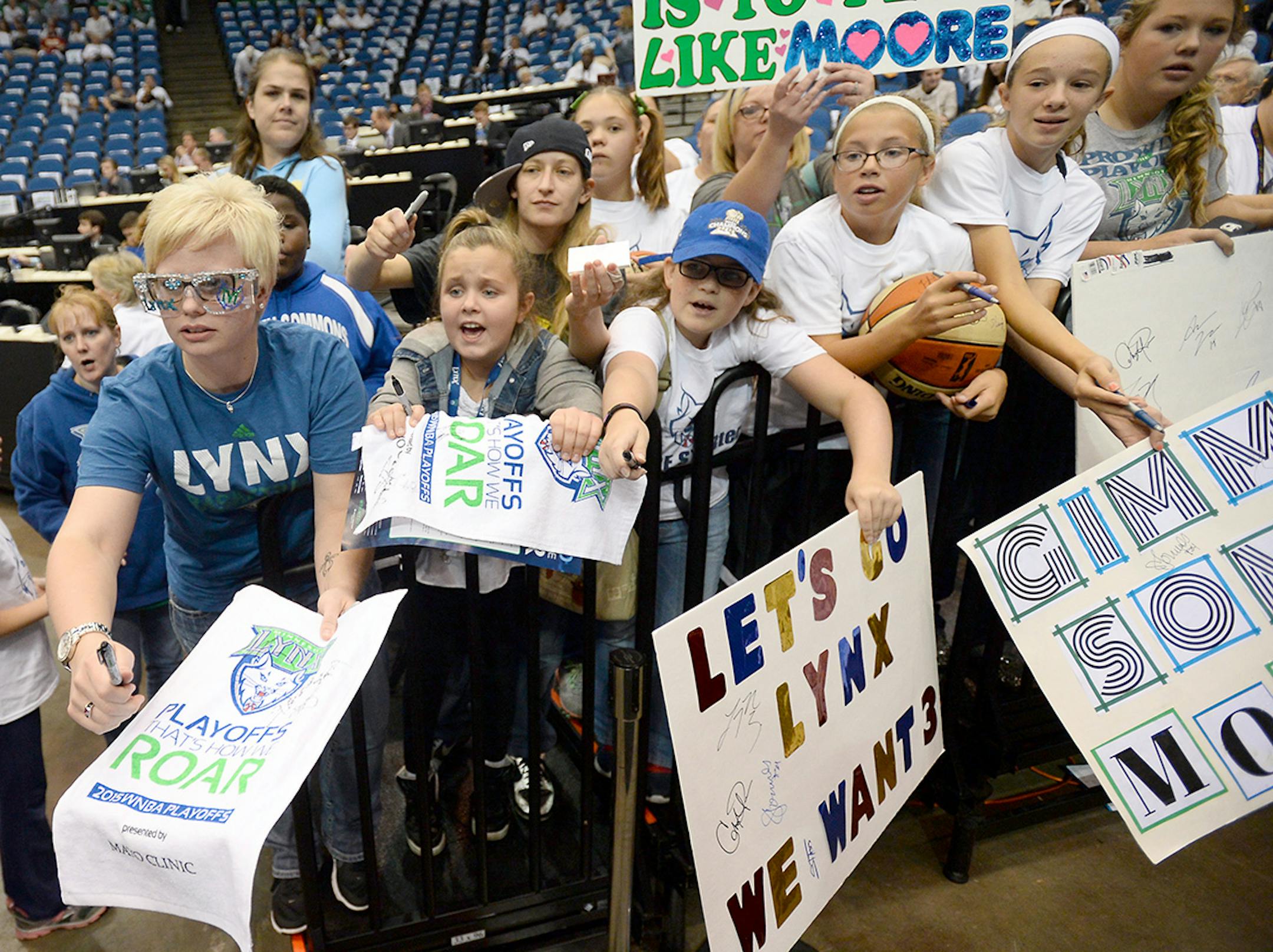 Young fans vied for the attention of Minnesota Lynx forward Maya Moore (23) as she left the court after pre-game warmups.