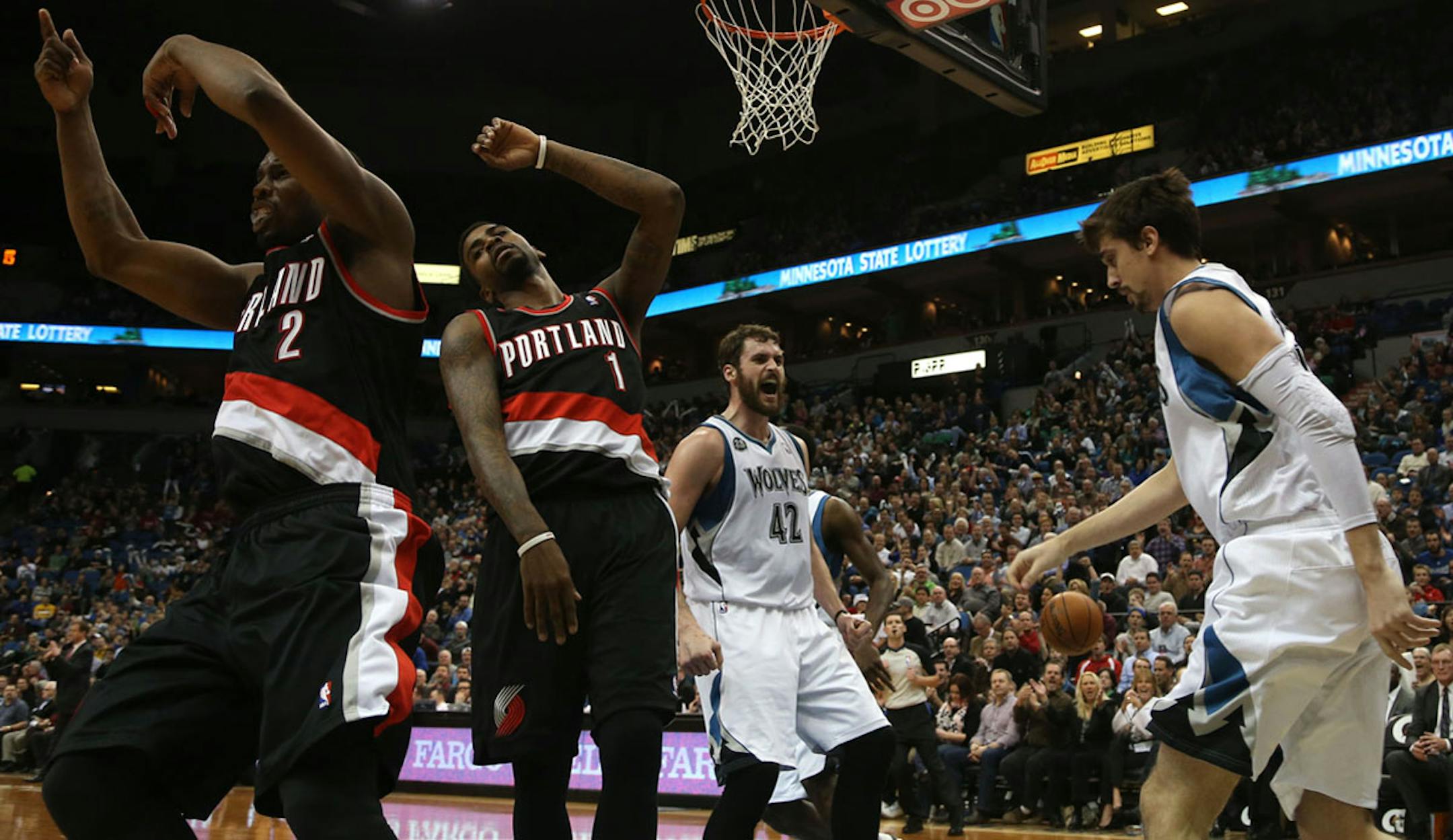Portland players threw up their hands as Wolves Kevin Love celebrated after teammate Alexey Shved scored during the first half at the Target Center in Minneapolis Wednesday, December 18, 2013. ] (KYNDELL HARKNESS/STAR TRIBUNE) kyndell.harkness@startribune.com