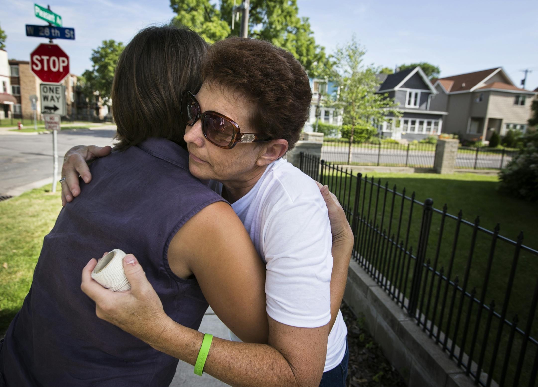 Natalie Hanson, the mother of Jessica Hanson, hugs a well-wisher during a memorial for her daughter.