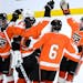 Grand Rapids players celebrated their 6-4 victory over Maple Grove Thursday night.
